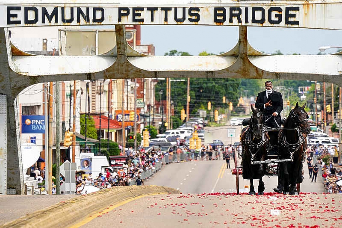 Body of John Lewis crosses Alabama bridge for final time